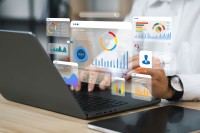 laptop with floating infographics